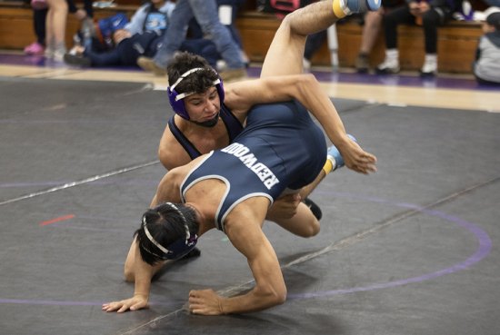 Lemoore's Isiah Moore looks to win during Thursday's West Yosemite League match against Redwood. The Tigers defeated the Rangers 58-9.